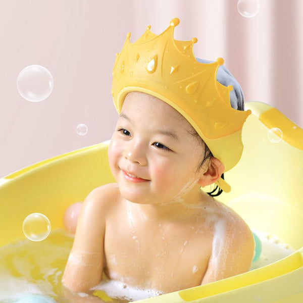 RoyalShower™, couronne protectrice pour enfants, empêche l'eau et le shampoing de couler dans les yeux et les oreilles lors du bain, fabriquée en silicone alimentaire sans BPA. Idéal pour stimuler l'imagination et transformer le bain en moment royal.