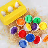 Jouet BabyEggs™ Montessori pour l'apprentissage des formes et des couleurs, favorisant la coordination œil-main et la motricité fine. Conçu en plastique alimentaire sans BPA pour les enfants de plus de 9 mois.