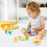 Jouet BabyEggs™ Montessori pour l'apprentissage des formes et des couleurs, favorisant la coordination œil-main et la motricité fine. Conçu en plastique alimentaire sans BPA pour les enfants de plus de 9 mois.